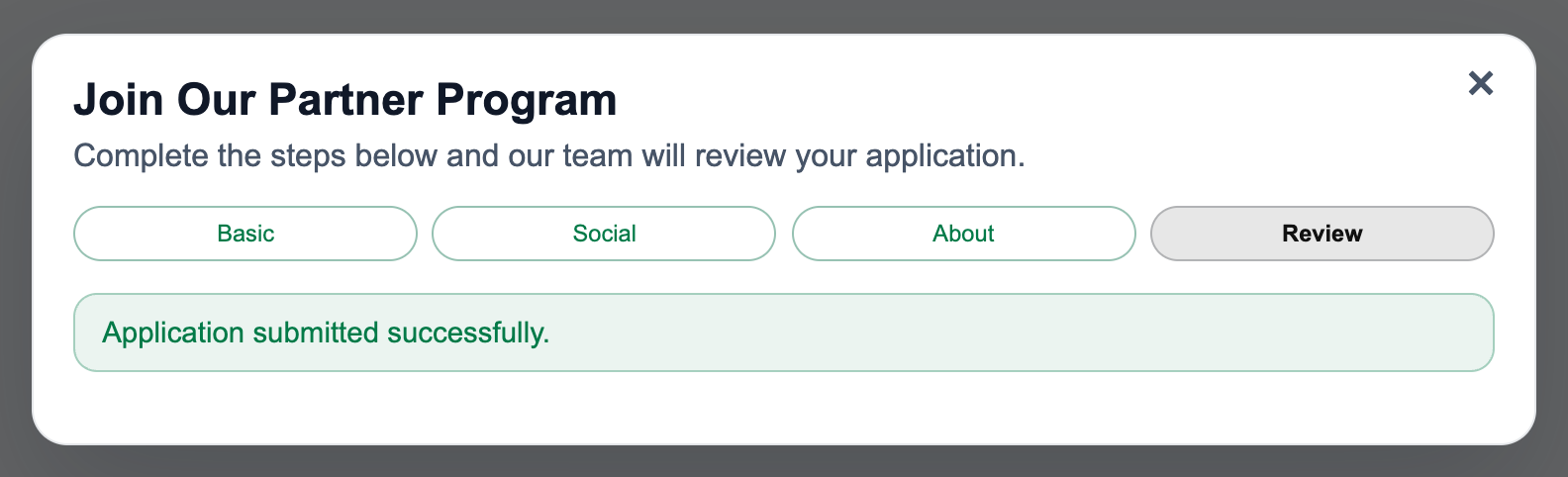 Partner application dialog with a green Application submitted successfully alert, merchant-review instruction, and close icon.